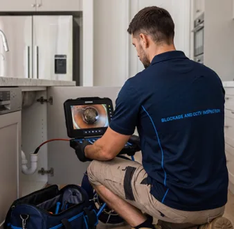 Clearing a blocked sink at a Chiswick property
